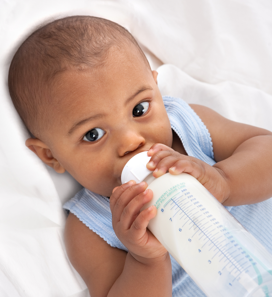 baby drinking out of bottle