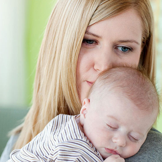 mother holding baby