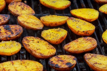 Potatoes on barbecue grill