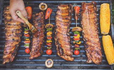 Preparing pork ribs on a barbecue grill