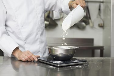 Chef measuring flour on scale