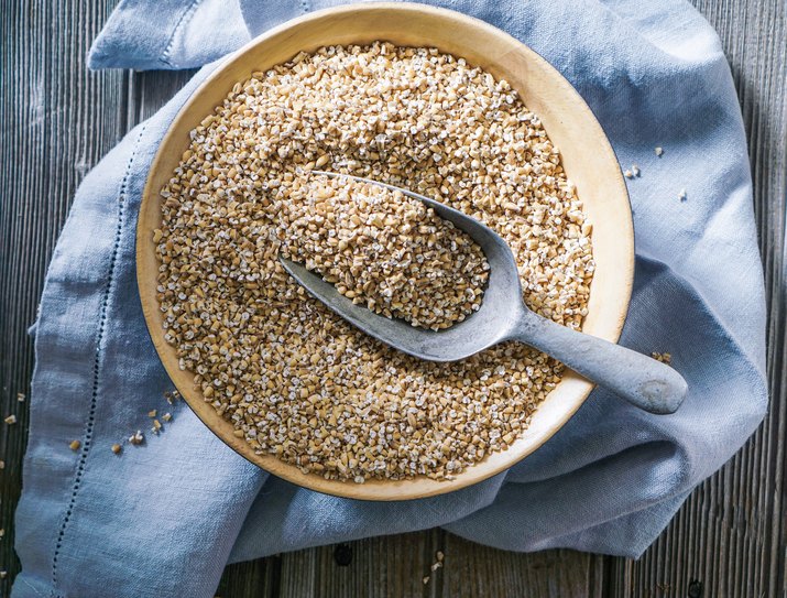 Raw Organic Steel Cut Oats in a Bowl.