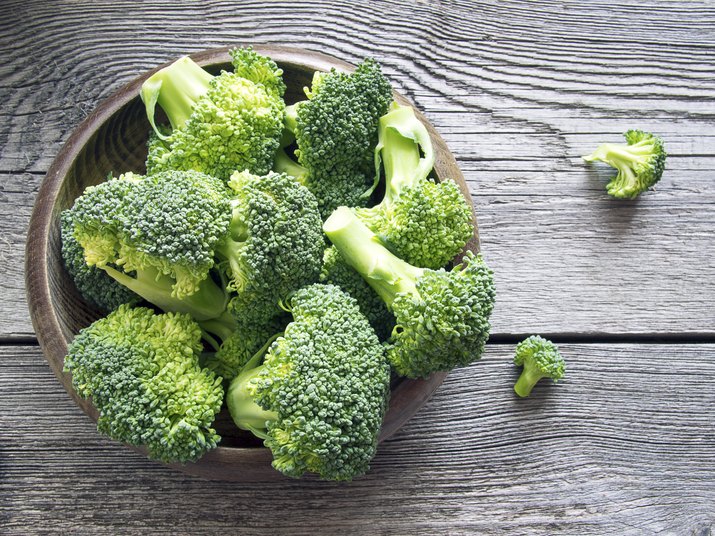 Raw broccoli on wooden background