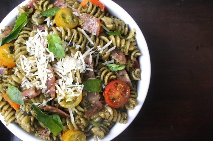 Italian pasta salad with cherry tomatoes and shredded parmesan