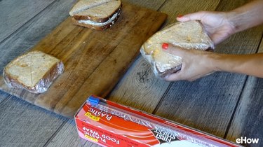 Wrapping sandwiches for freezing.