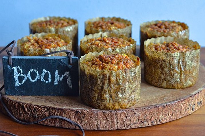 Seven freshly baked protein-loaded sweet potato and oatmeal mini-casseroles.