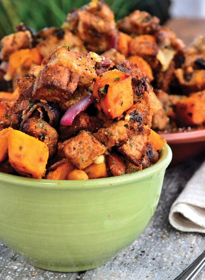 A vibrant bowl of orange sweet potato salad.