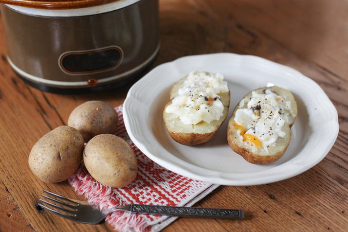 plate of baked potatoes with toppings