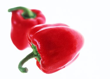 close-up of two red bell peppers